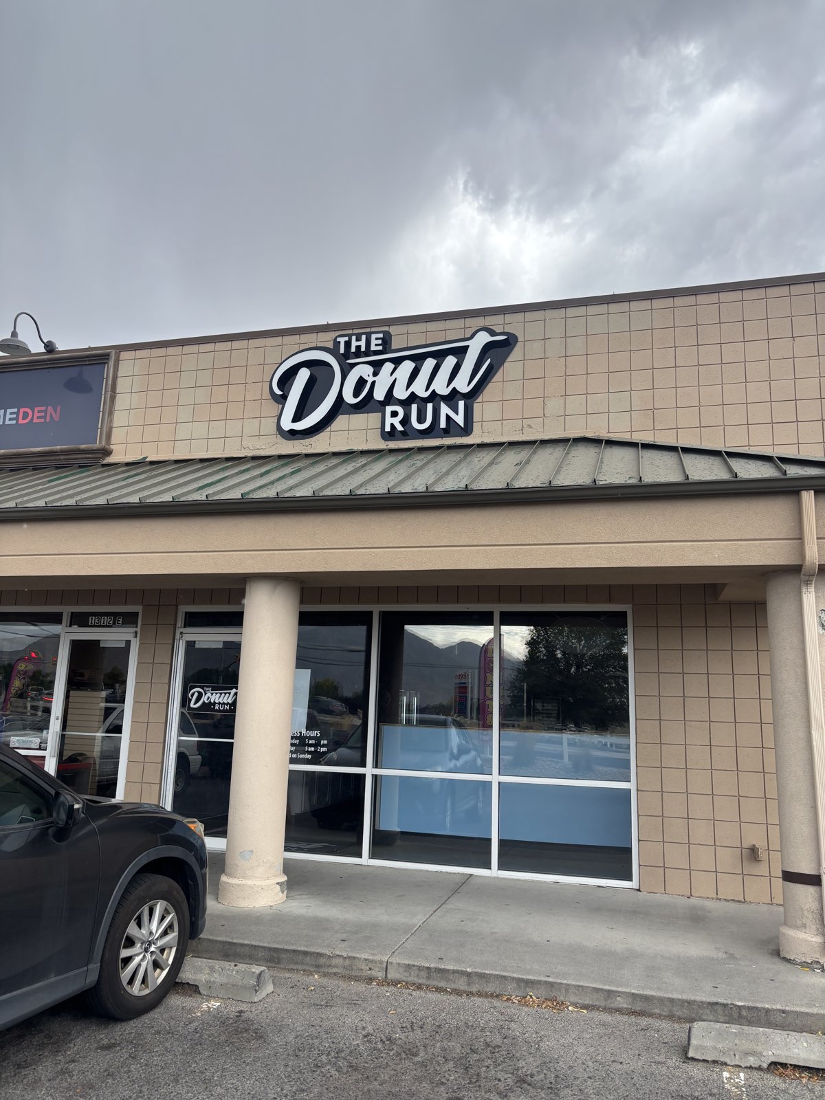 A Donut Run shopfront, sign above the door