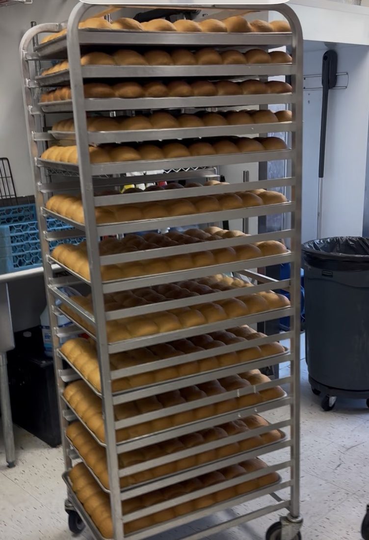 A full rack of dinner rolls baked at The Donut Run